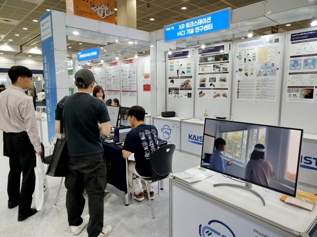 On-site photo of the center booth with a demo at the forum