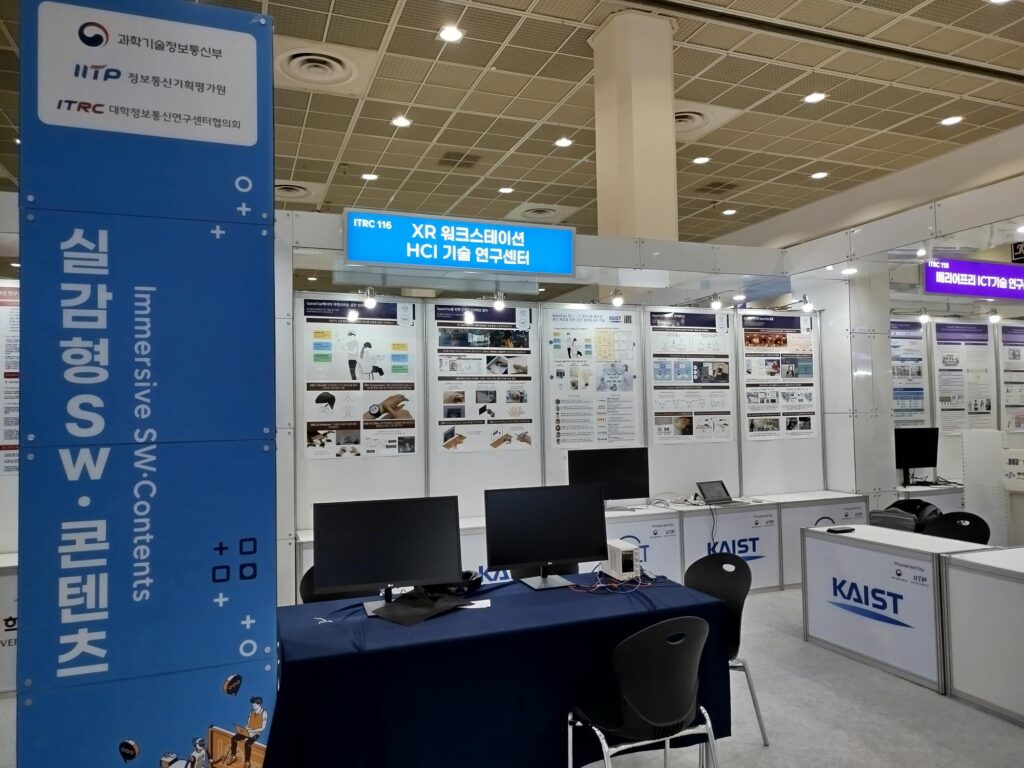 On-site photo of the center booth with a demo at the forum
